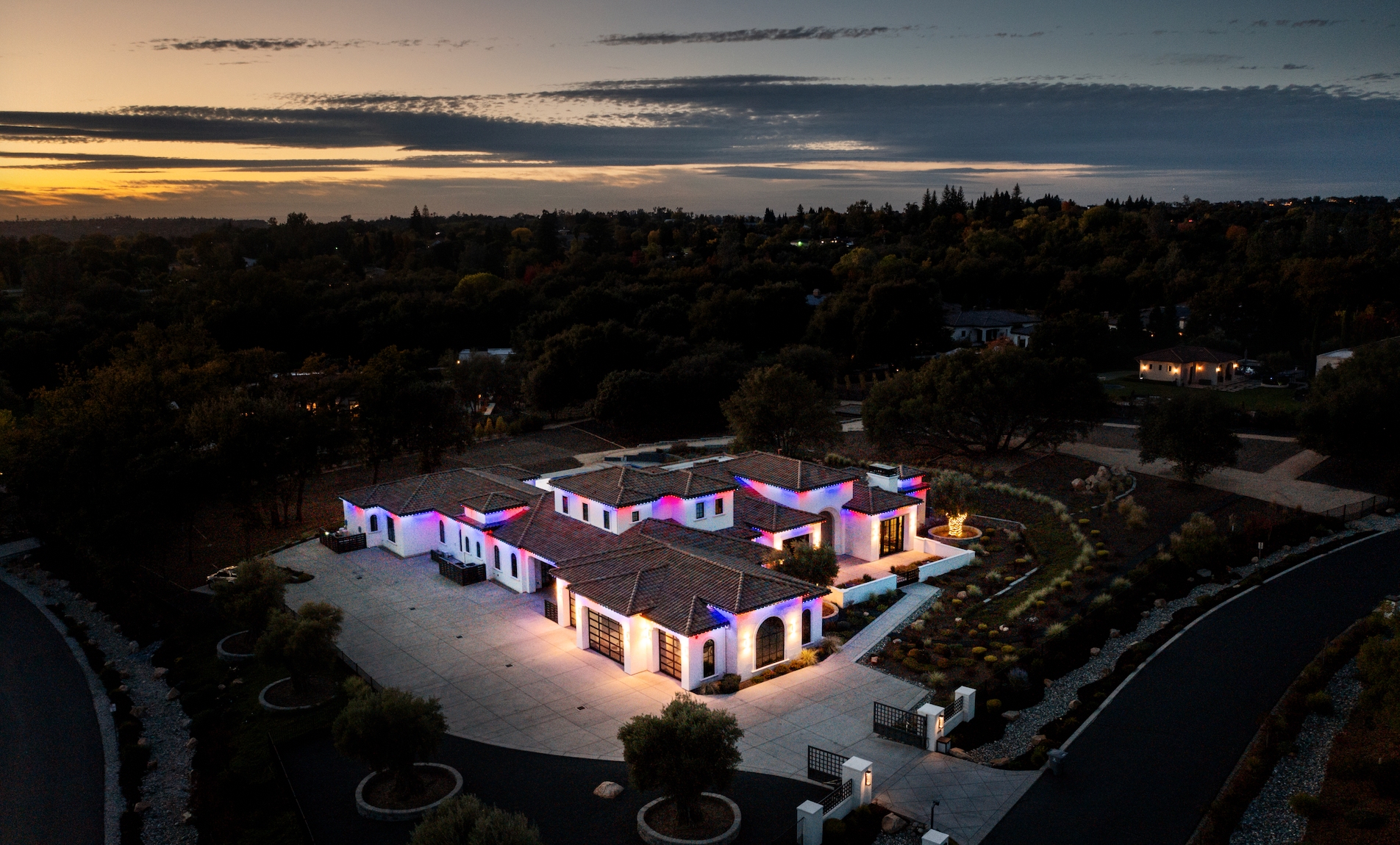 Color matched permanent lighting track blending into roofline trim on a Sacramento home