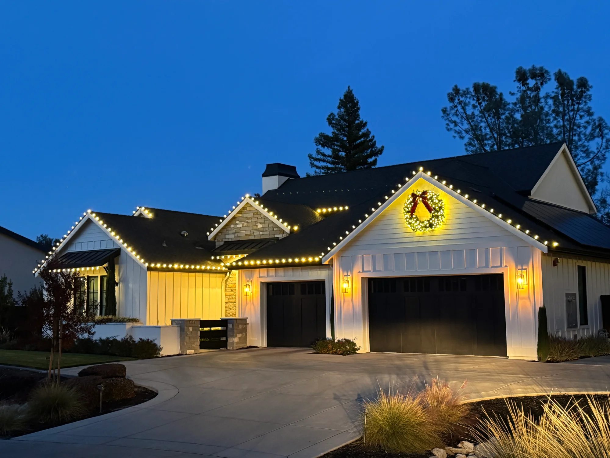 Christmas lights automatically turning on at dusk on a Sacramento home