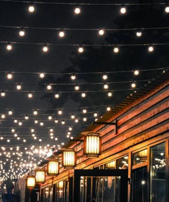 Layered warm white event lighting at a Sacramento wedding