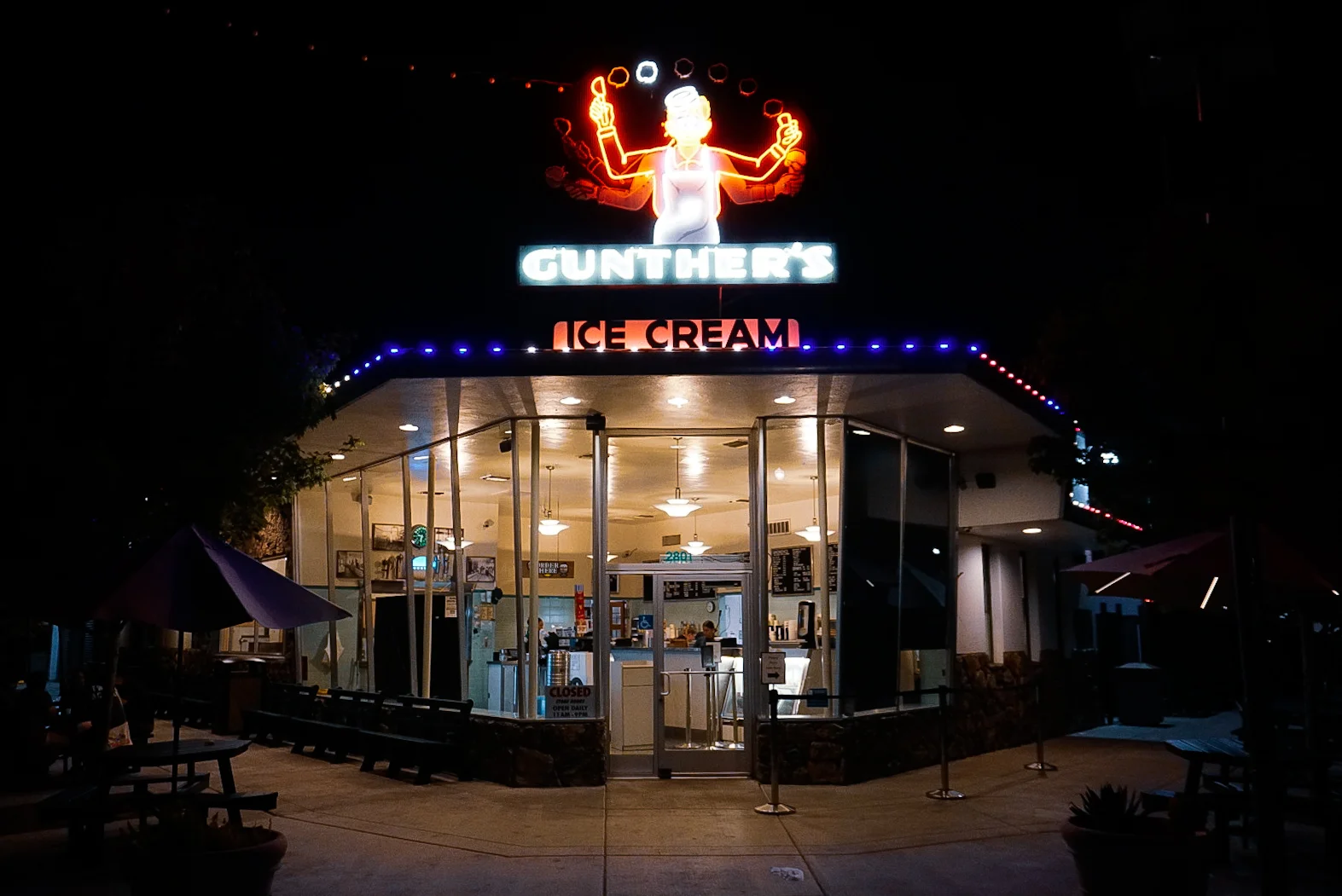 Permanent brand colored lighting on a Sacramento shopping center at night