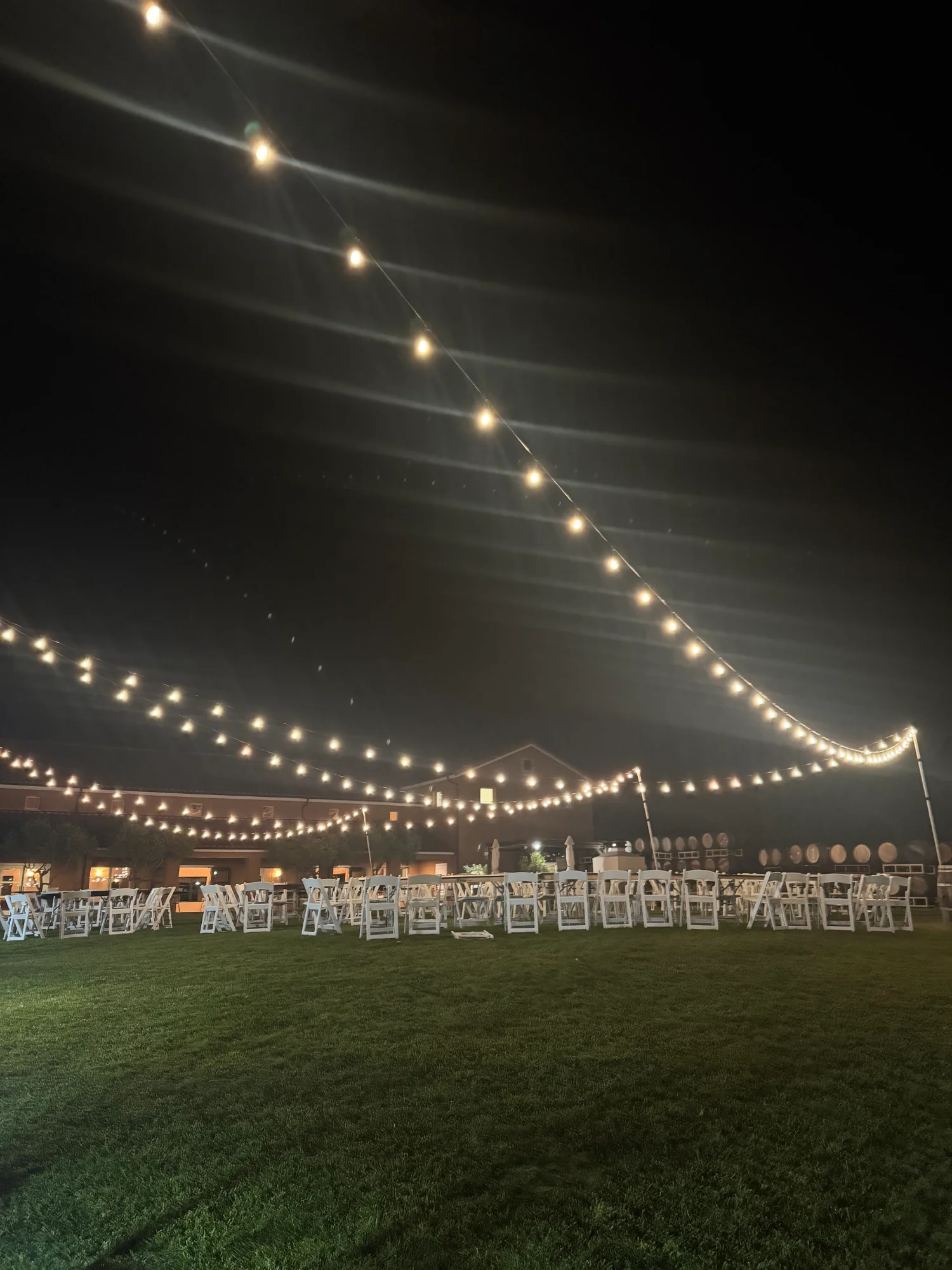 Dimmed warm white lighting during a nighttime wedding reception in Sacramento
