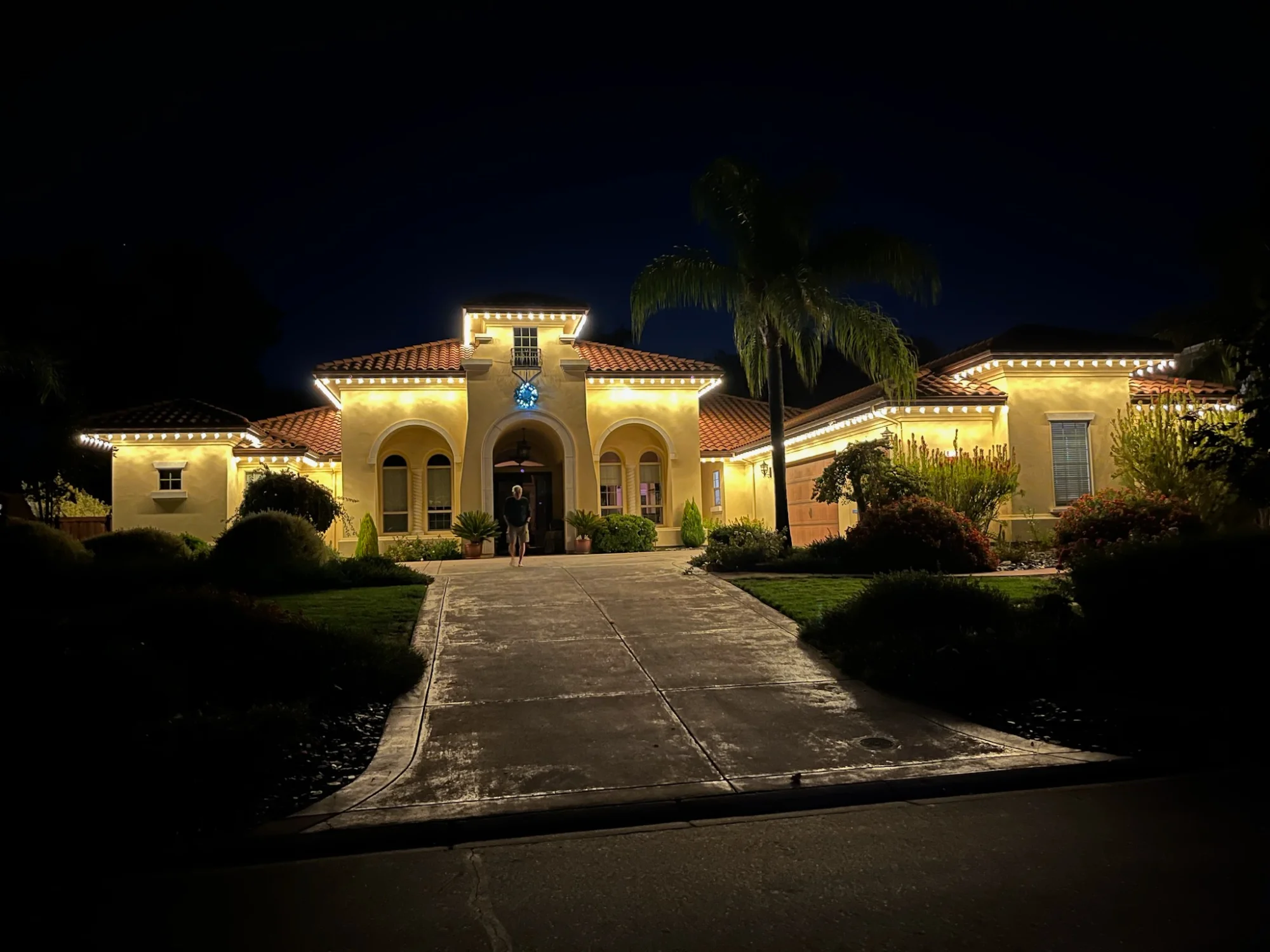 Beautifully finished Christmas light installation on a Sacramento home at night