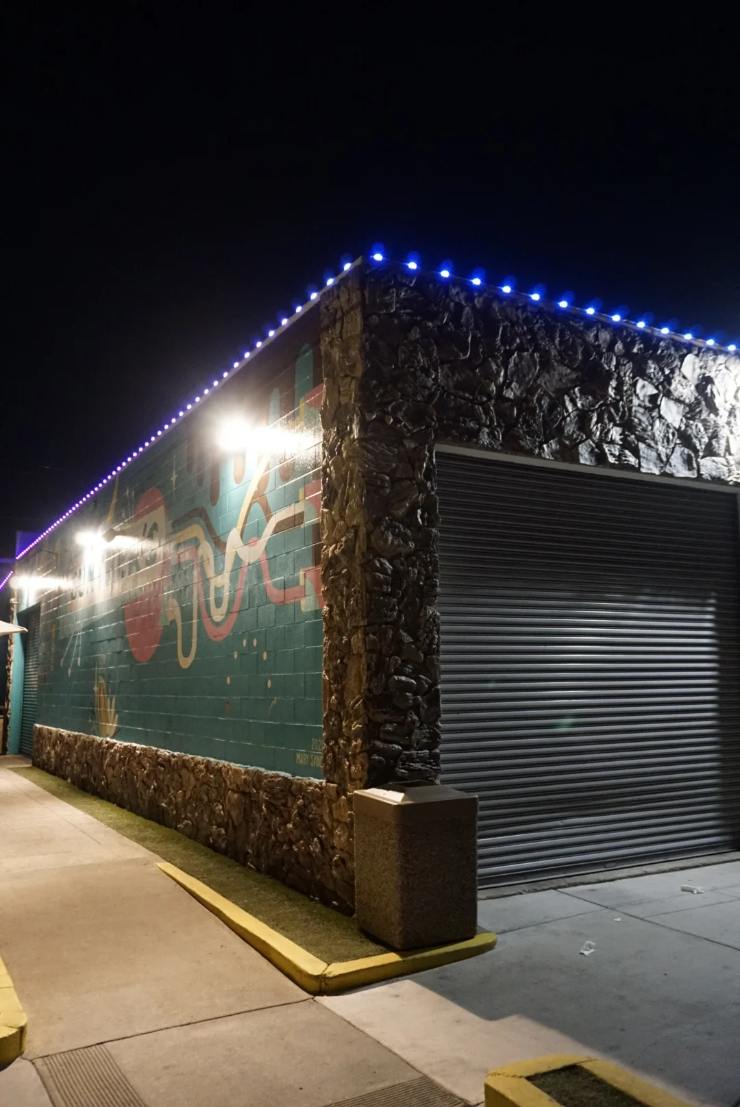 Sacramento retail storefront with permanent brand-colored lighting