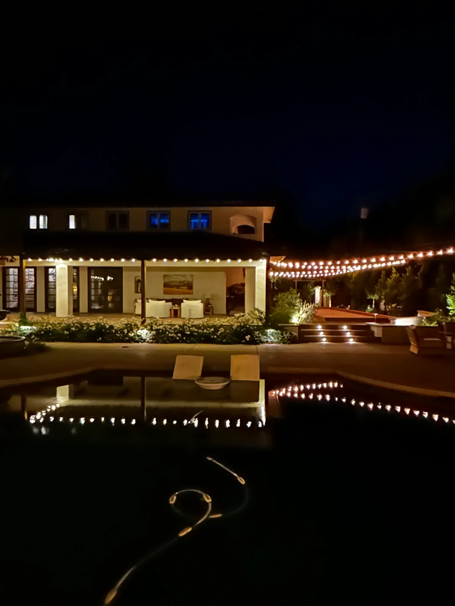 Updated Christmas light display with warm white accents on a Sacramento home