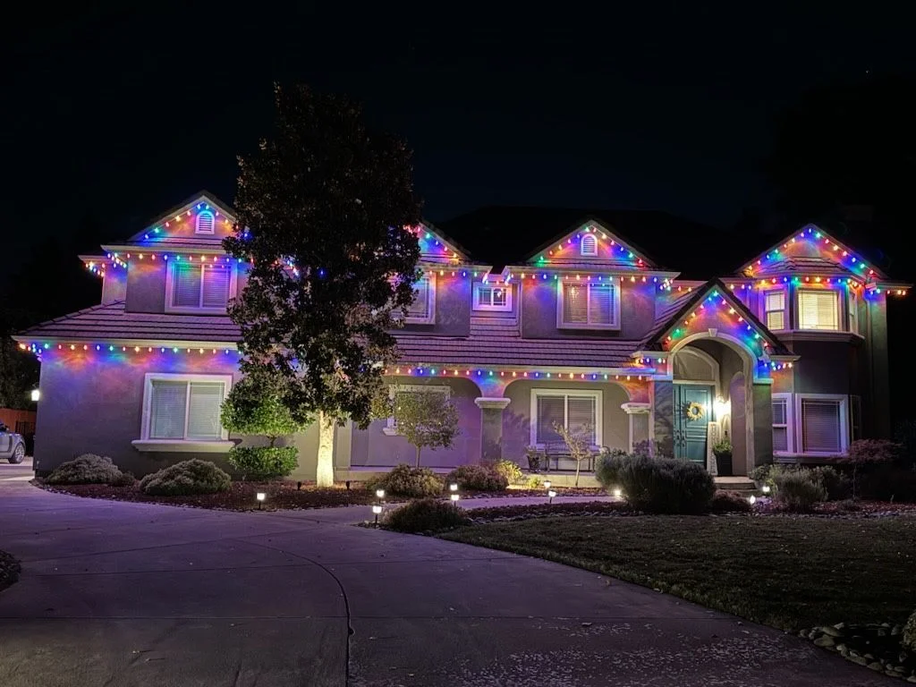 Mixed color temperature Christmas lights corrected on a Sacramento home