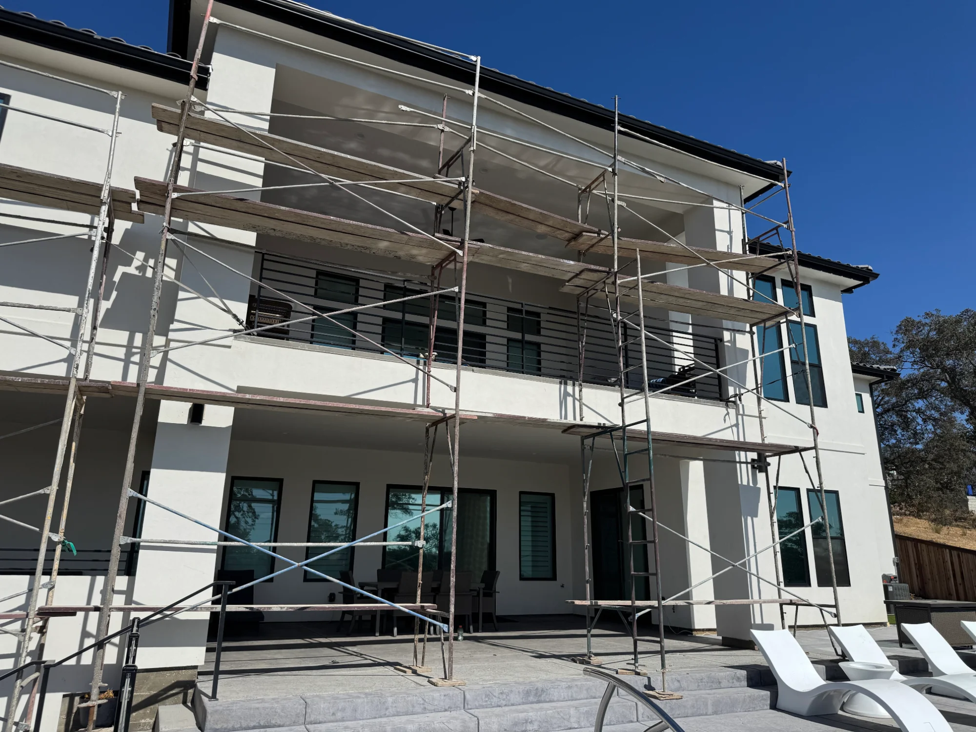 Large multi-story Sacramento home requiring scaffolding for Christmas light installation