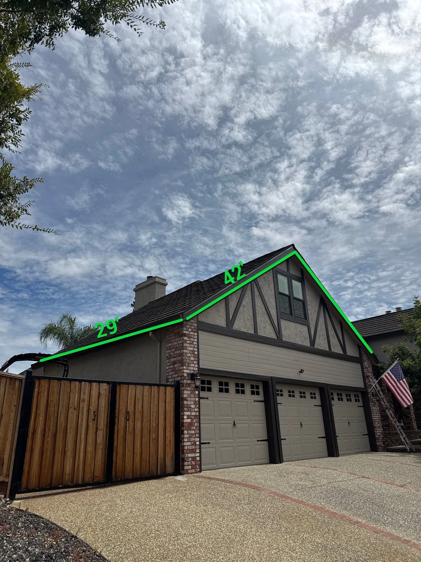Marked up photo showing the planned permanent lighting route across the gables of a Folsom Tudor style home