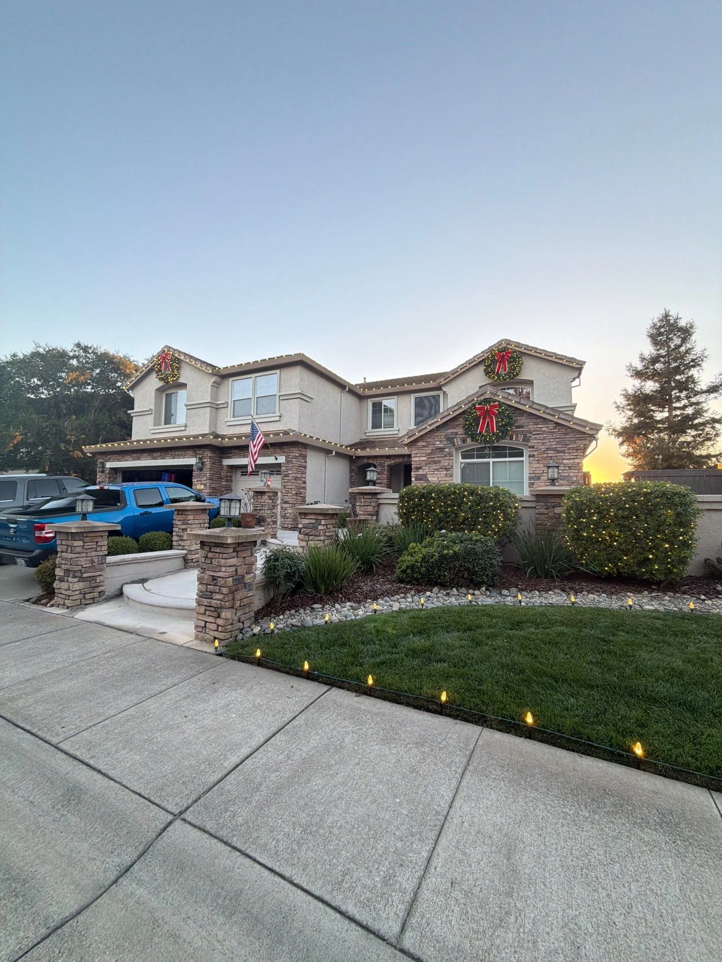 Two-story stucco home with tile roof and stone veneer in North Natomas, Sacramento